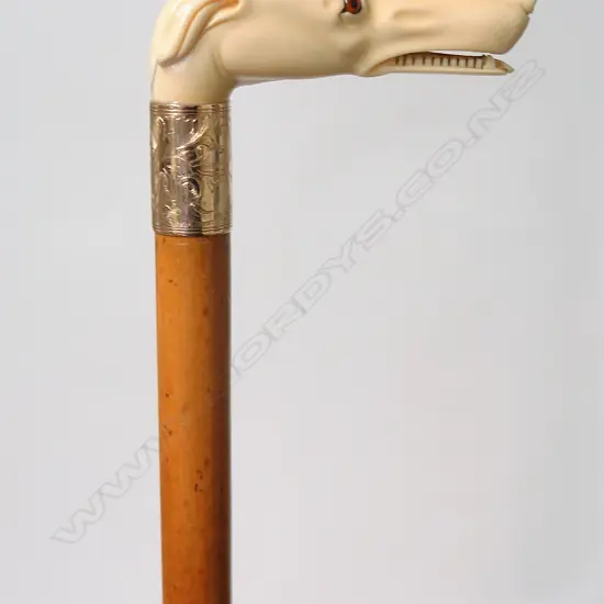 A quality 19thC carved ivory greyhound handled walking stick