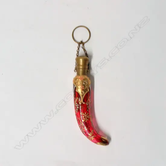 A Victorian cranberry glass perfume bottle