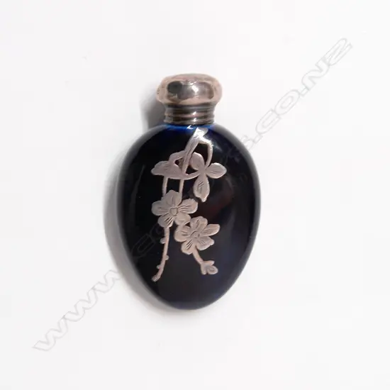 An early 20thC porcelain and silver scent bottle