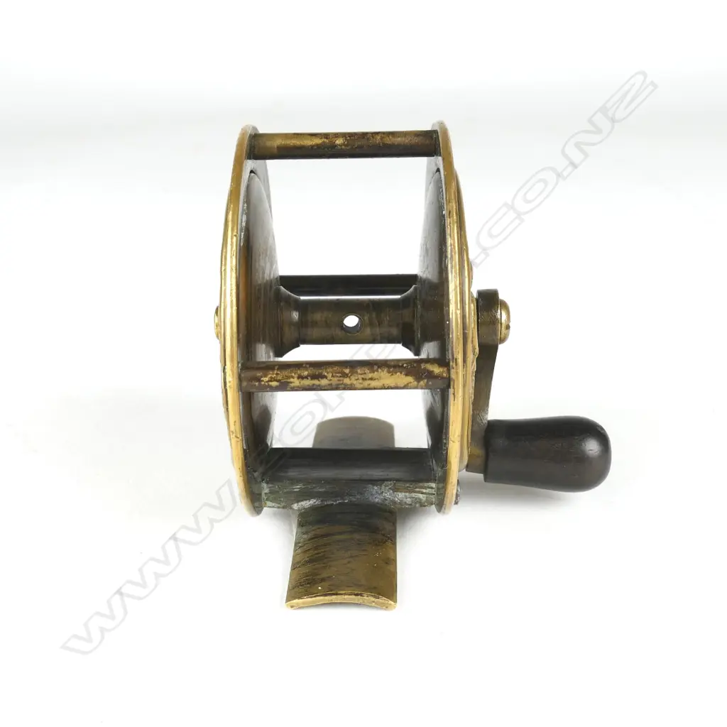 A rare and unusual English 2¼” brass reel Image 1++