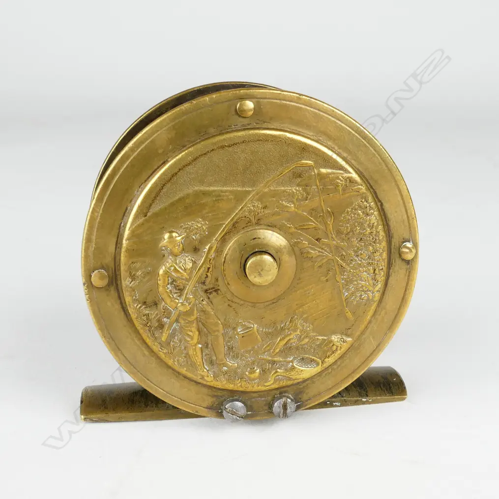 A rare and unusual English 2¼” brass reel Image 1++