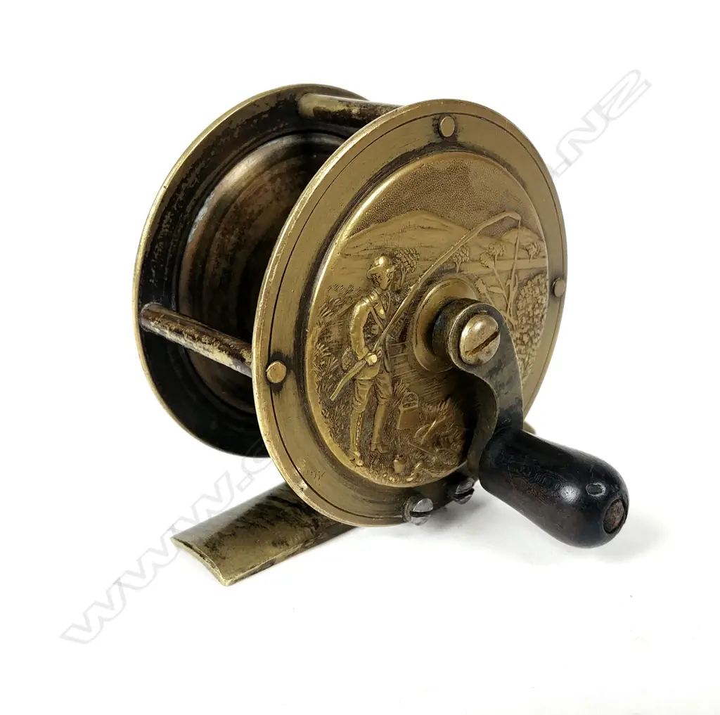 A rare and unusual English 2¼” brass reel Image 1++