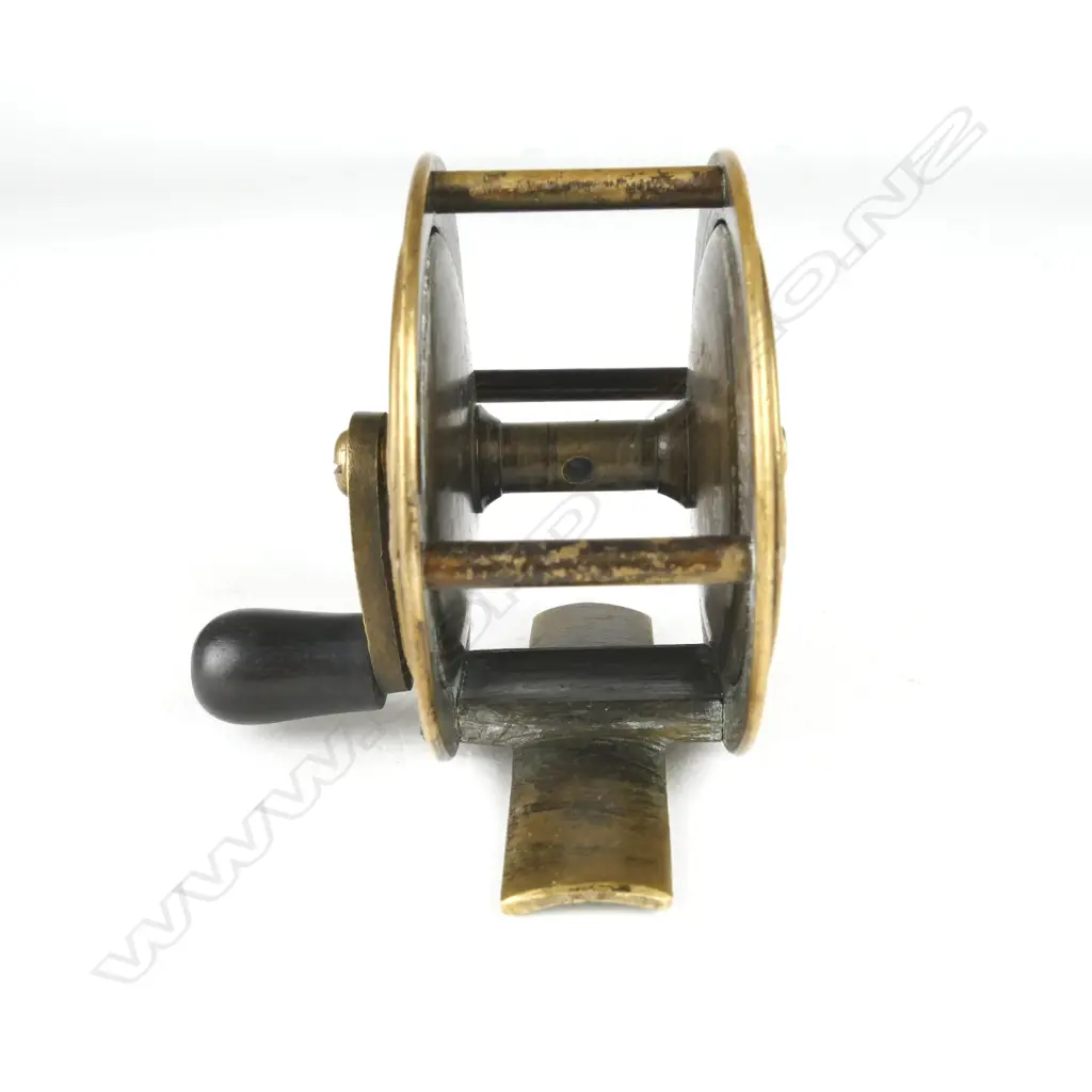 A rare and unusual English 2¼” brass reel Image 1++