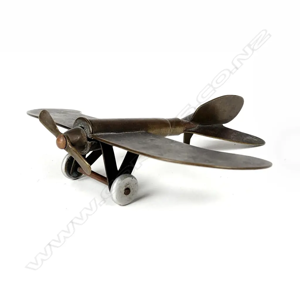 A small rare trench art model of a fixed wing propeller driven model aeroplane Image 1++