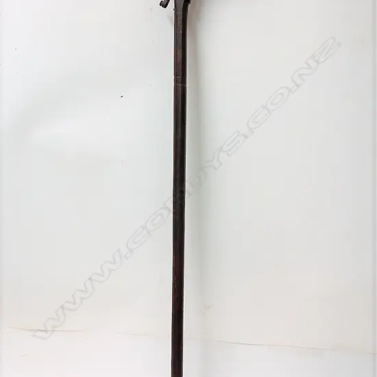 An old cast iron walking stick gun