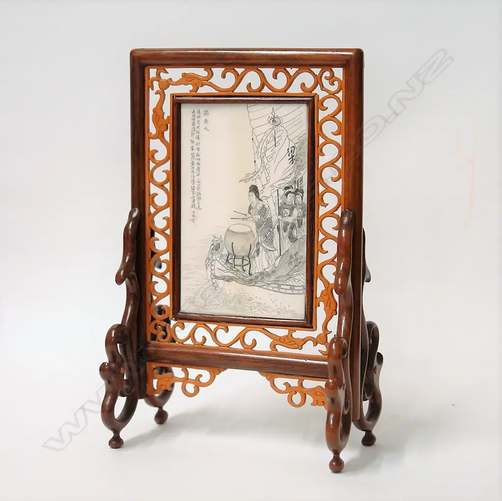 A Chinese finely engraved ivory plaque in stand Image 1++