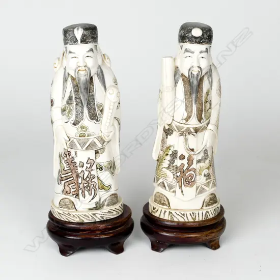 A pair of Chinese ivory figures of noblemen
