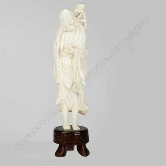 A Chinese ivory figure of an immortal