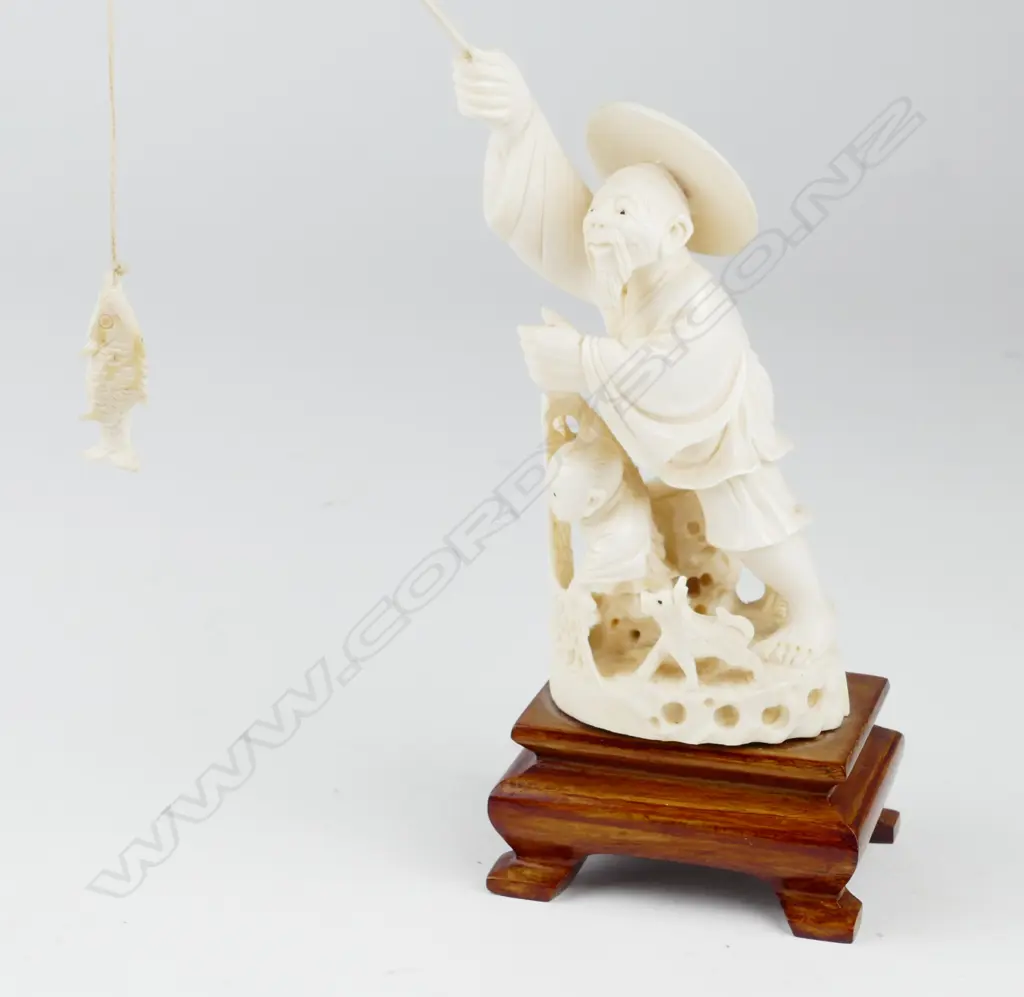 A Chinese carved ivory fisherman Image 1++