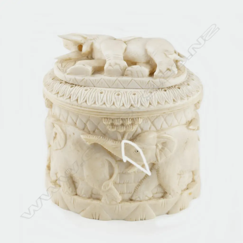 A carved ivory tusk box Image 1++