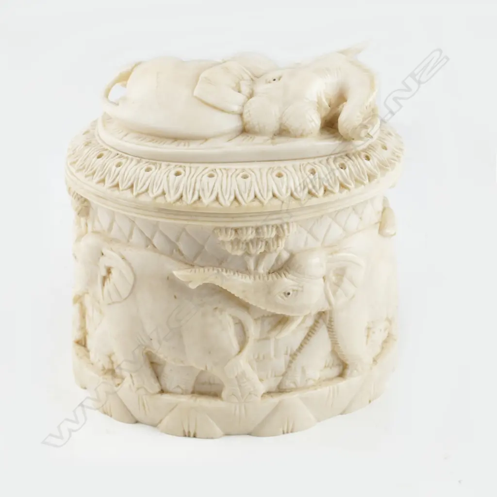 A carved ivory tusk box Image 1++