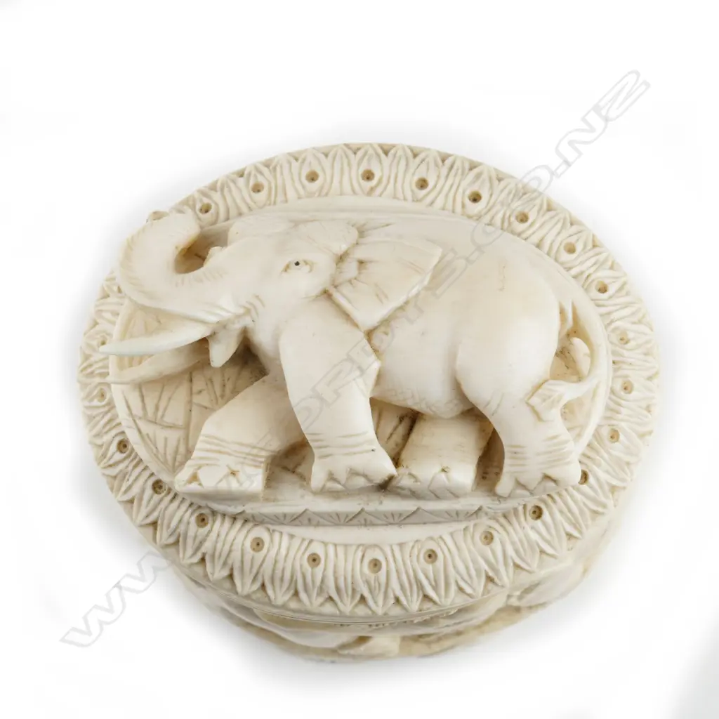 A carved ivory tusk box Image 1++