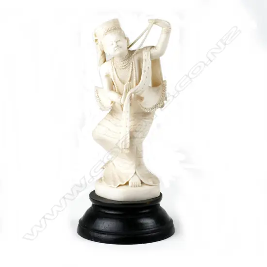 A Chinese carved ivory fisherman figure