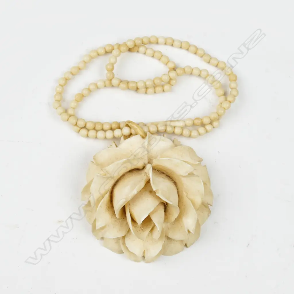 A large vintage carved ivory flower head pendant on an ivory bead necklace Image 1++