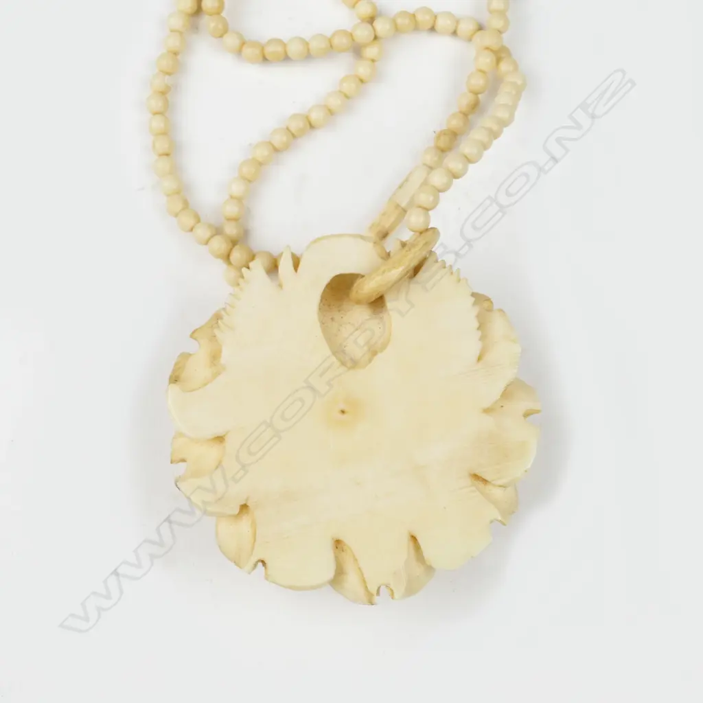A large vintage carved ivory flower head pendant on an ivory bead necklace Image 1++