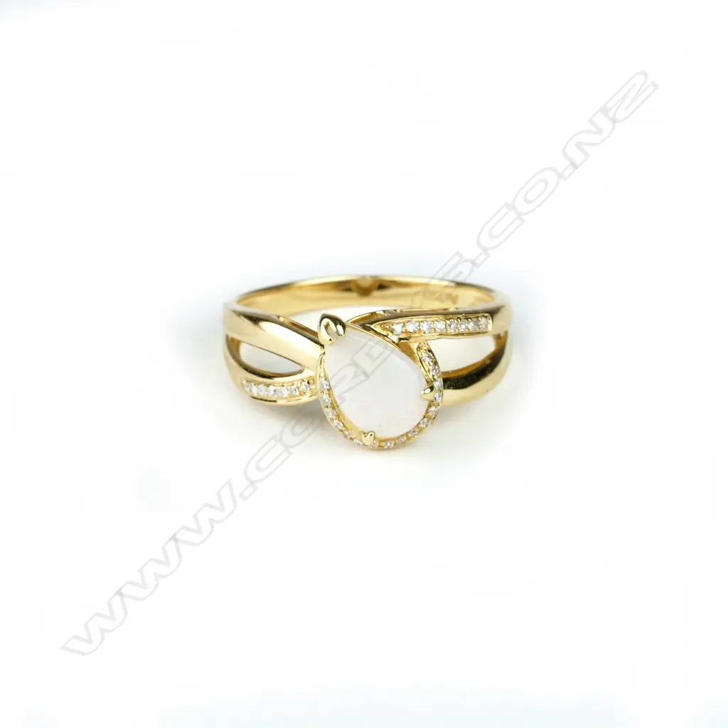 An 18ct. yellow gold opal and diamond dress ring Image 1++