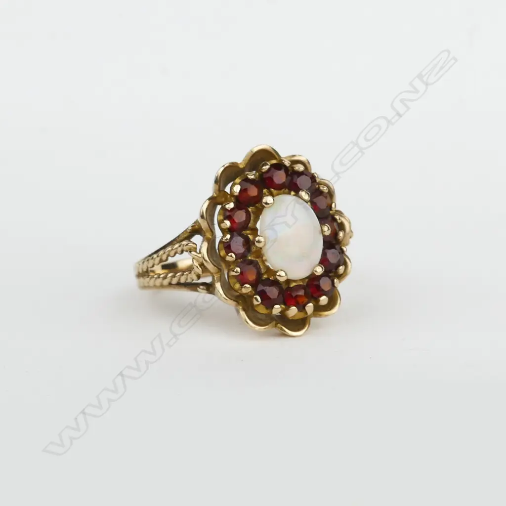 A vintage 9ct. opal and garnet dress ring Image 1++