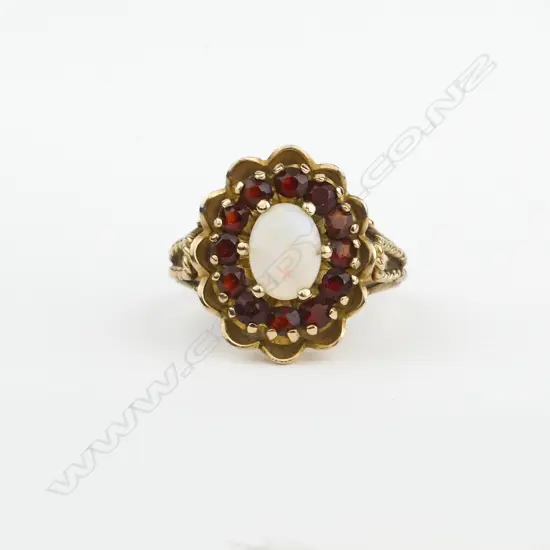 A vintage 9ct. opal and garnet dress ring