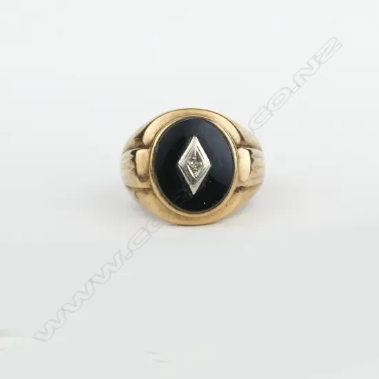 A vintage 9ct. gold gent's onyx and diamond signet ring