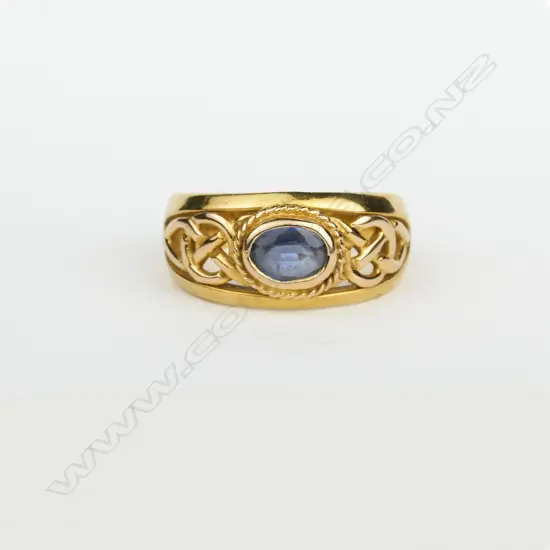 A substantial 18ct. yellow gold and sapphire dress ring
