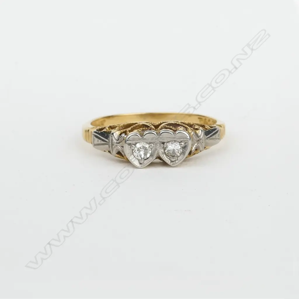 An early 20thC 18ct. yellow gold platinum and diamond twin heart ring Image 1++