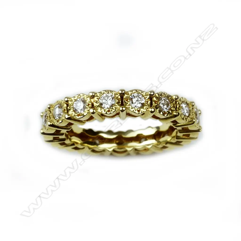 An 18ct. yellow gold and multi-diamond eternity band Image 1++