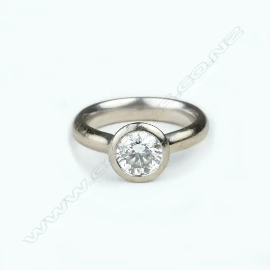 An 18ct. white gold and diamond solitaire ring