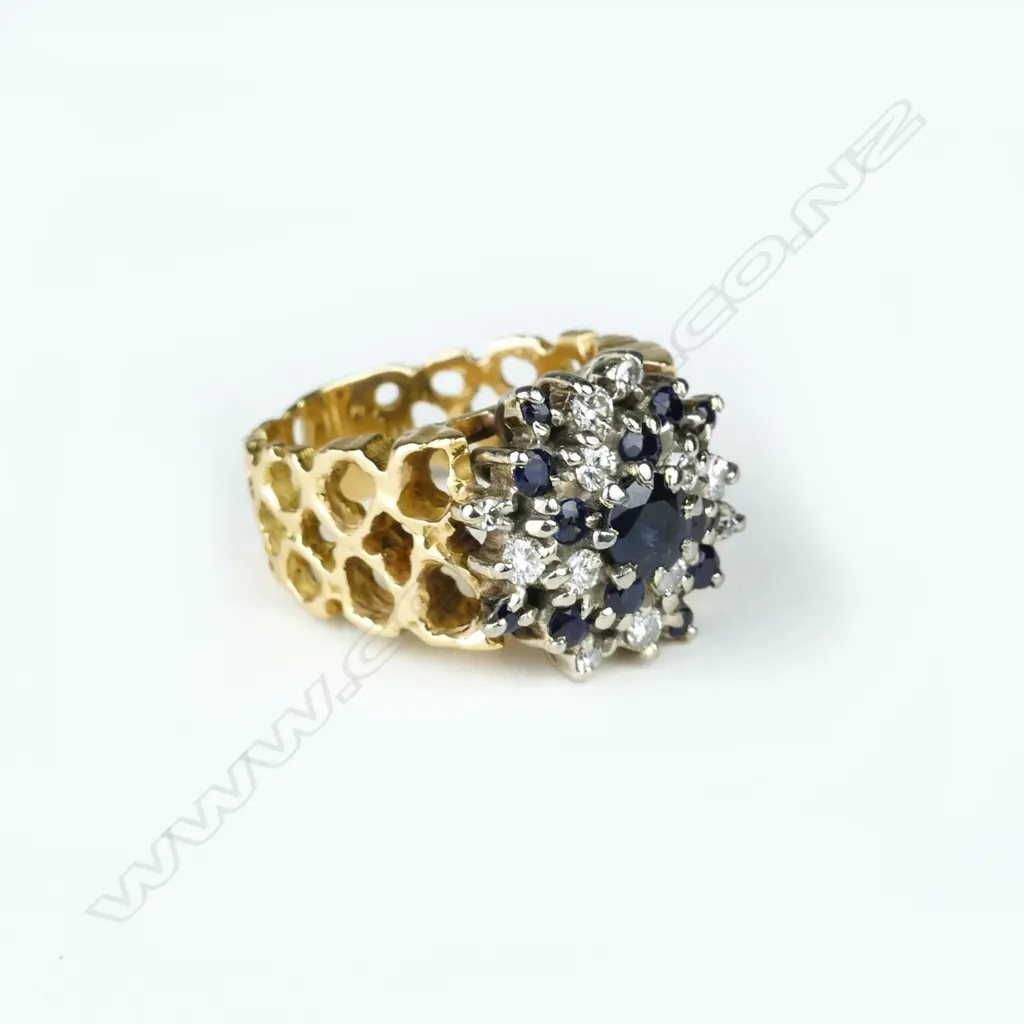 An 18ct. gold diamond and sapphire dress ring Image 1++