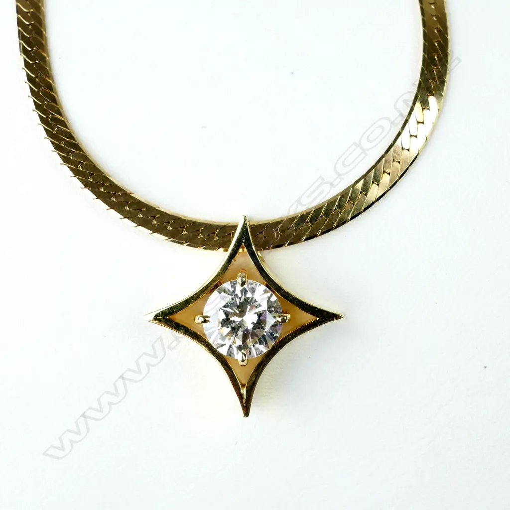 A 1.63ct. diamond solitaire pendant in 14ct. yellow gold mount on 14ct. yellow gold chain Image 1++