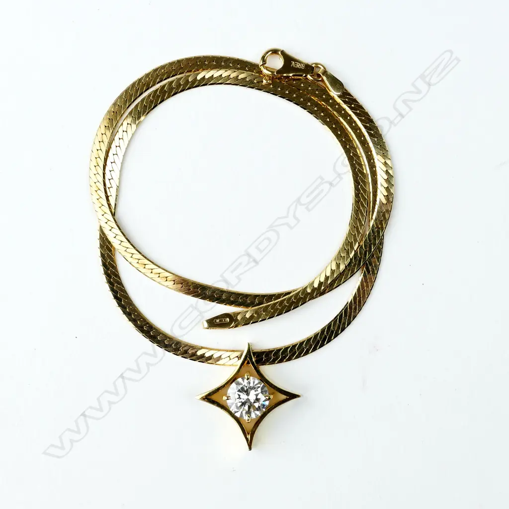 A 1.63ct. diamond solitaire pendant in 14ct. yellow gold mount on 14ct. yellow gold chain Image 1++