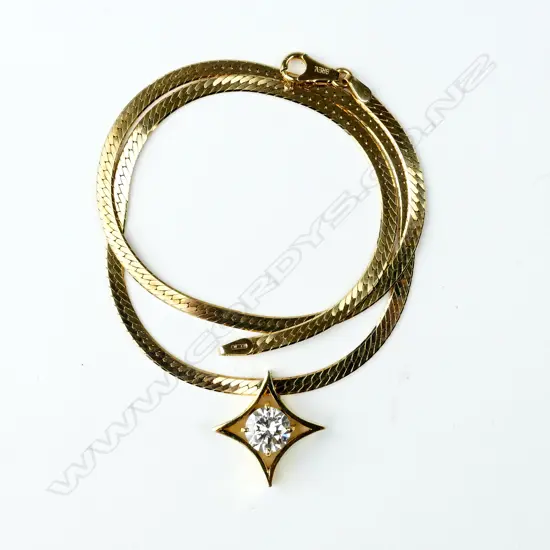 A 1.63ct. diamond solitaire pendant in 14ct. yellow gold mount on 14ct. yellow gold chain