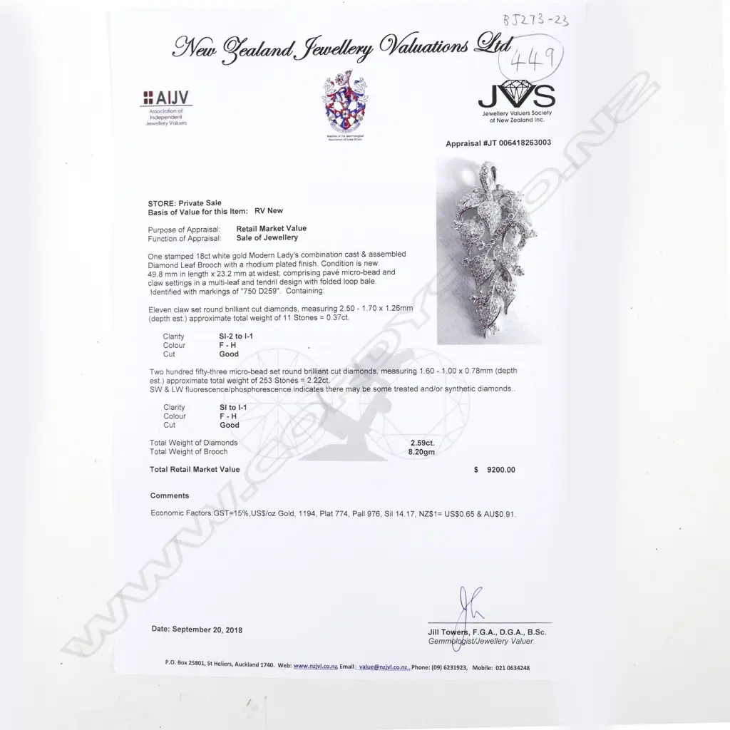 An 18ct. white gold and diamond pendant Image 1++