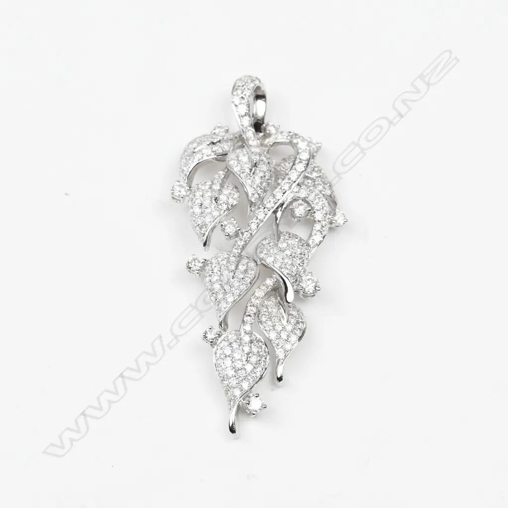 An 18ct. white gold and diamond pendant Image 1++