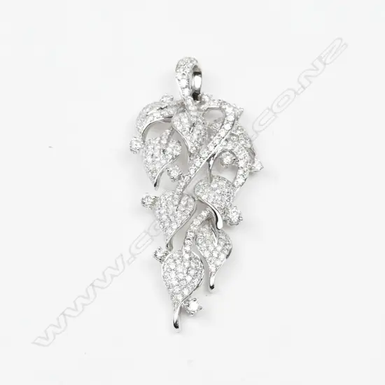 An 18ct. white gold and diamond pendant