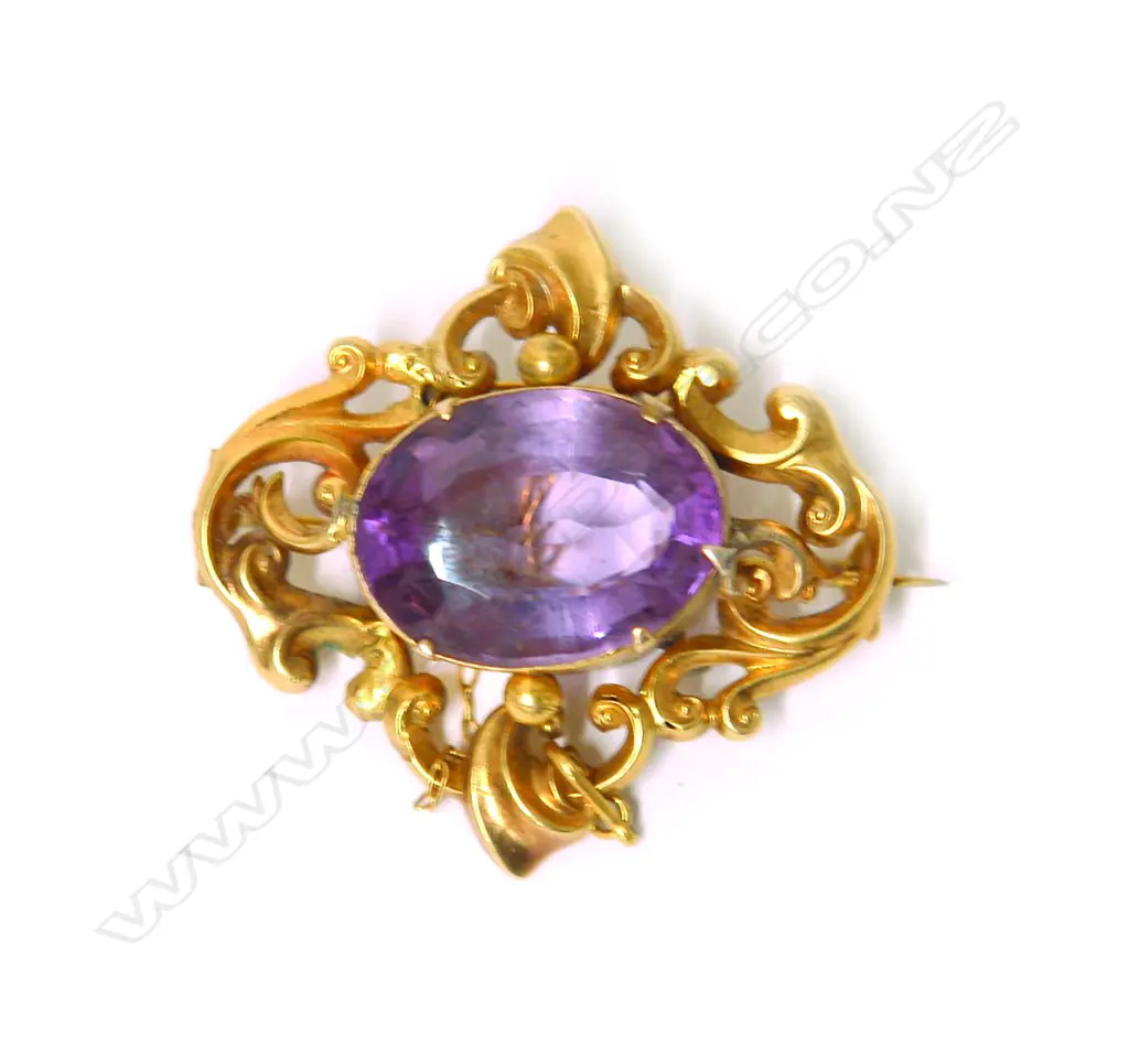A 19thC gilded 10ct yellow gold and amethyst brooch Image 1++