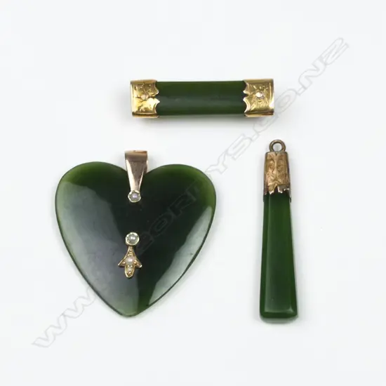 Three vintage N.Z. greenstone and gold mounted items