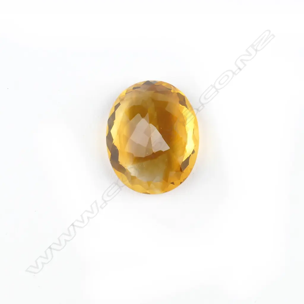 A large facet cut oval citrine gemstone Image 1++