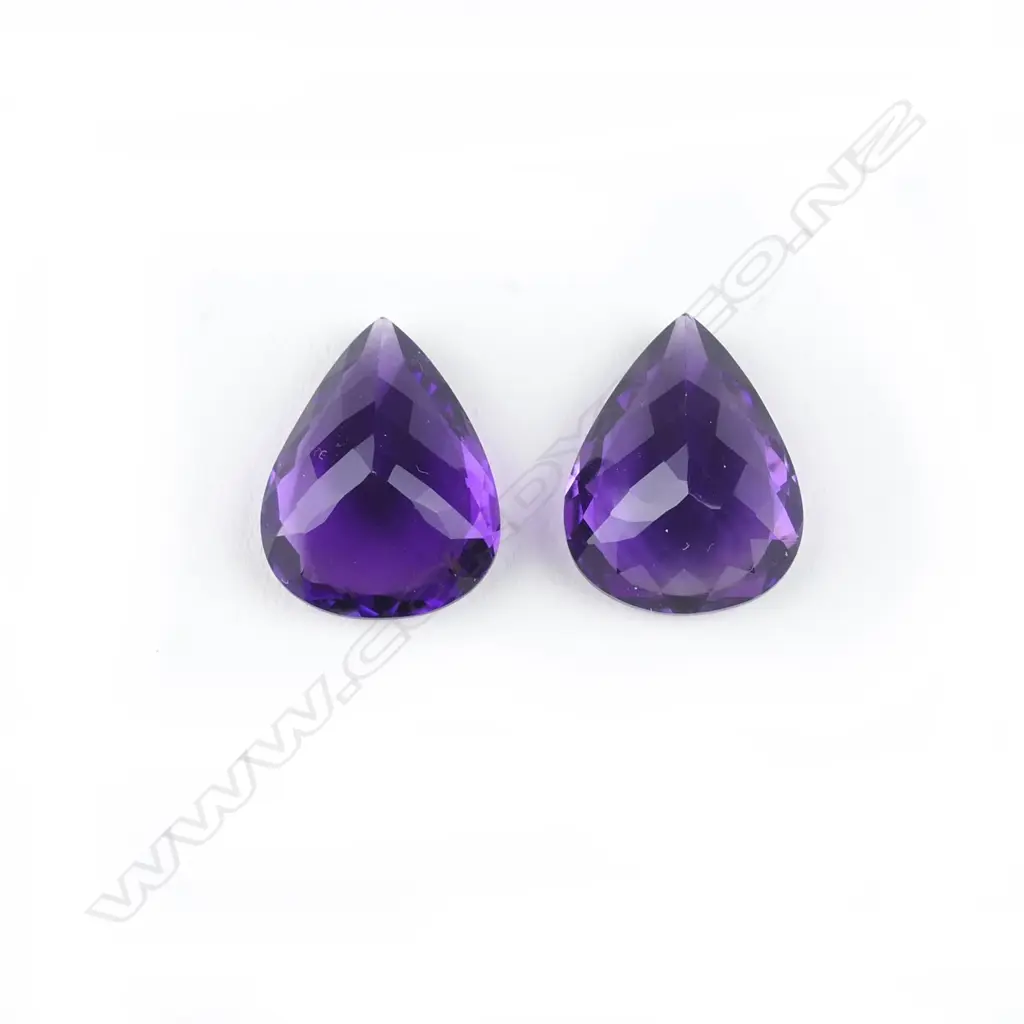 A pair of amethyst pear-cut gemstones Image 1++