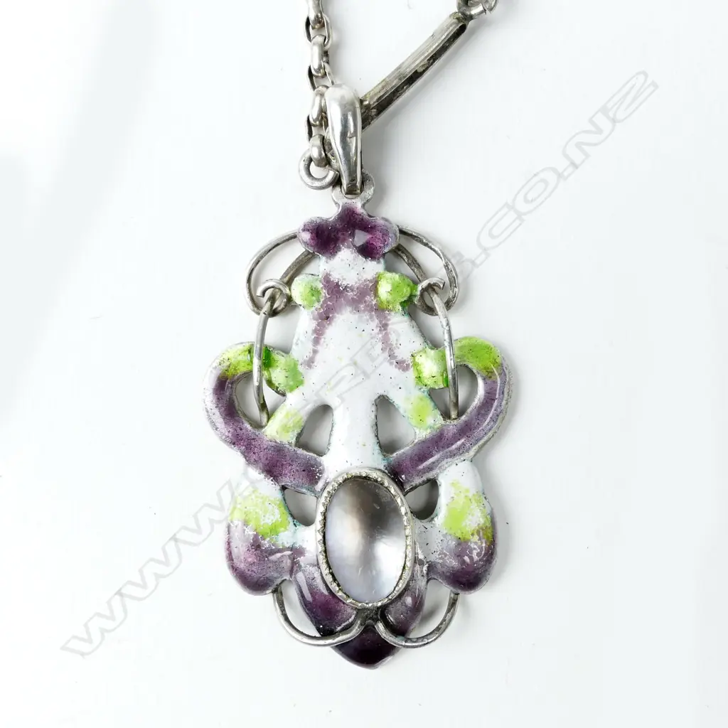 An interesting New Zealand Arts & Crafts silver enamel and m-o-p 'suffragist' pendant Image 1++