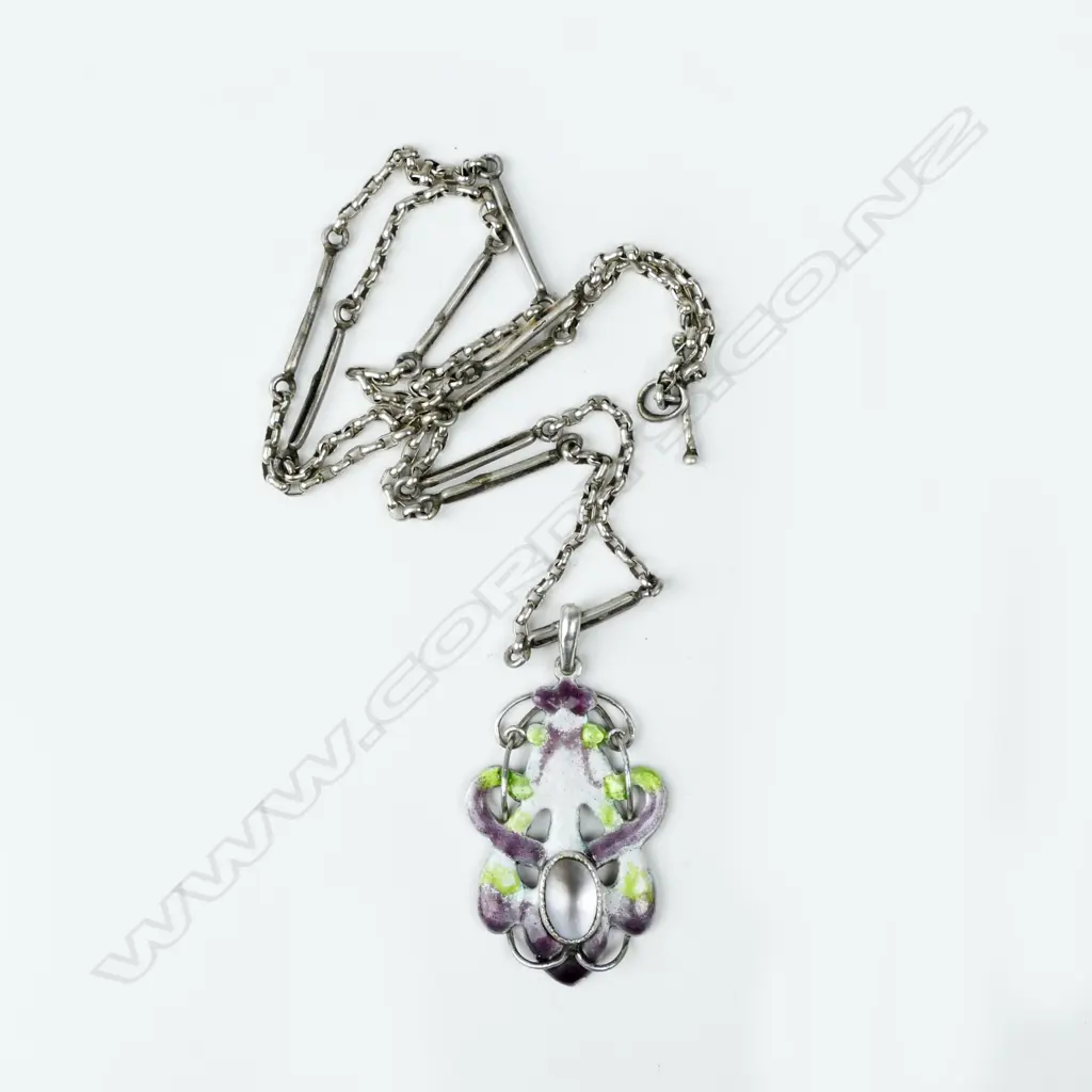 An interesting New Zealand Arts & Crafts silver enamel and m-o-p 'suffragist' pendant Image 1++