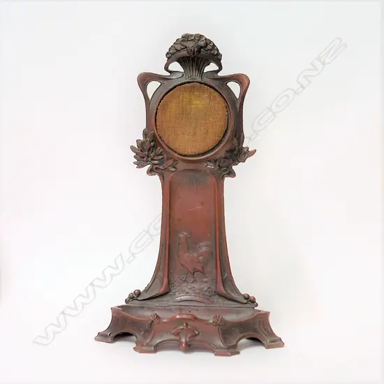A French Art Nouveau bronzed spelter pocket watch stand