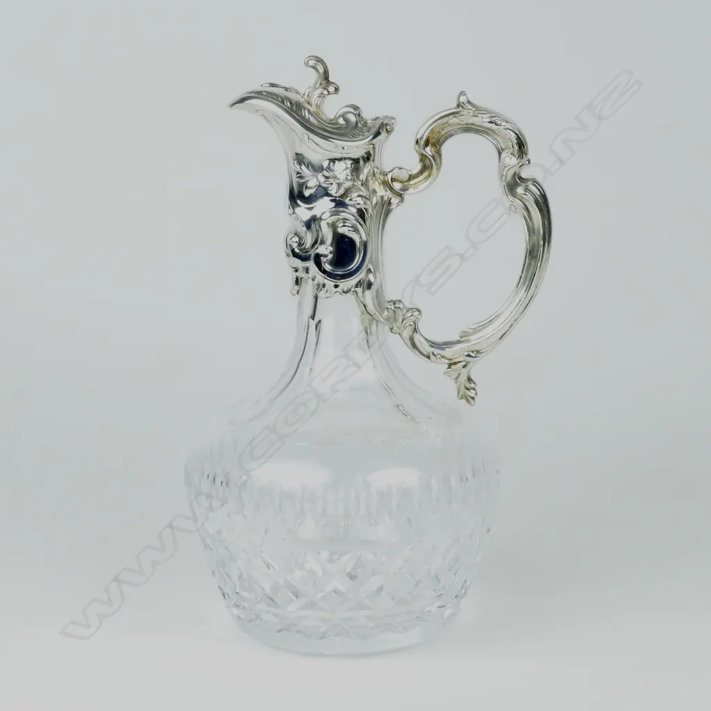 A heavy crystal claret jug of baluster shape Image 1++