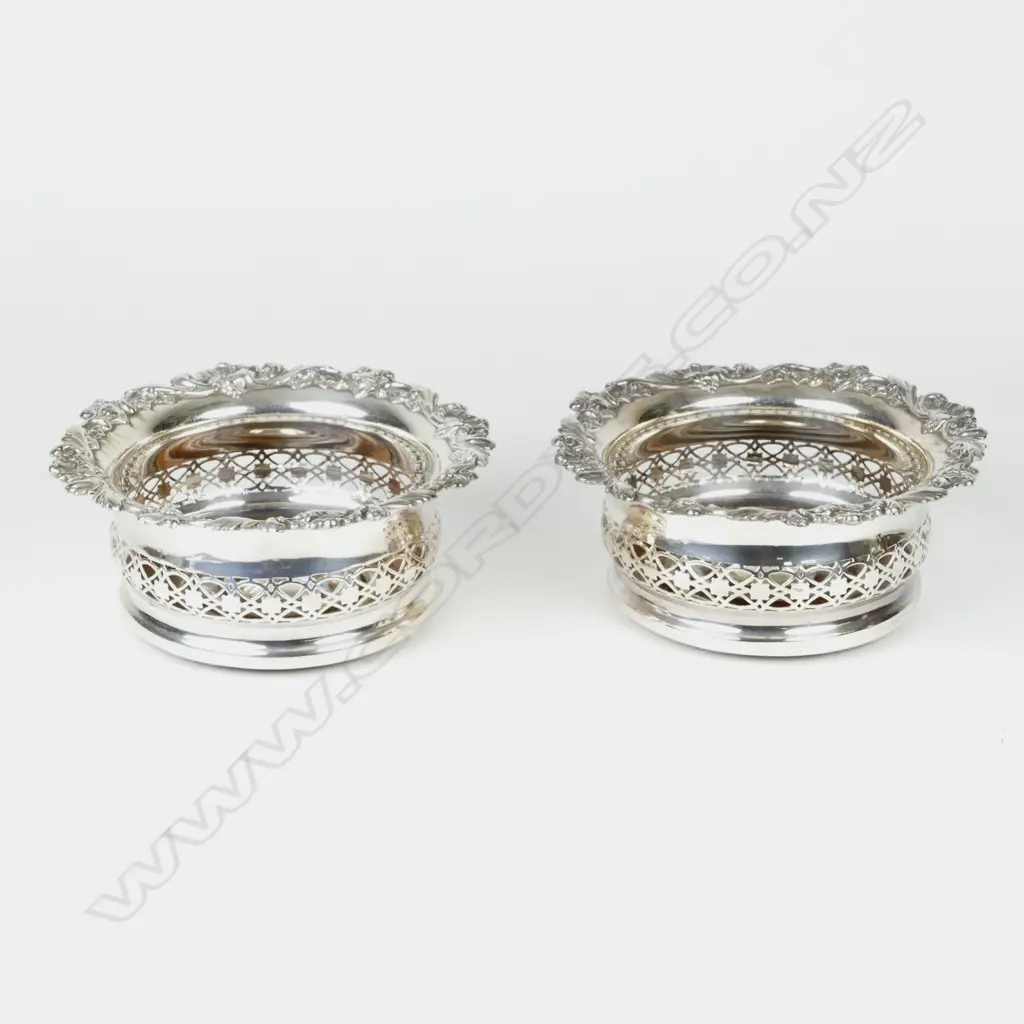 A pair of silver plate on copper wine coasters Image 1++