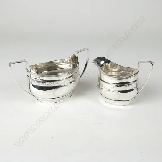 An Edwardian Georgian Revival silver cream jug and two-handled basin