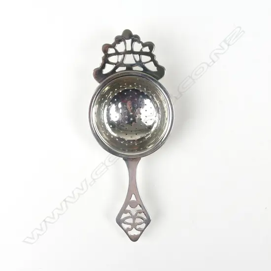 A modern silver tea strainer