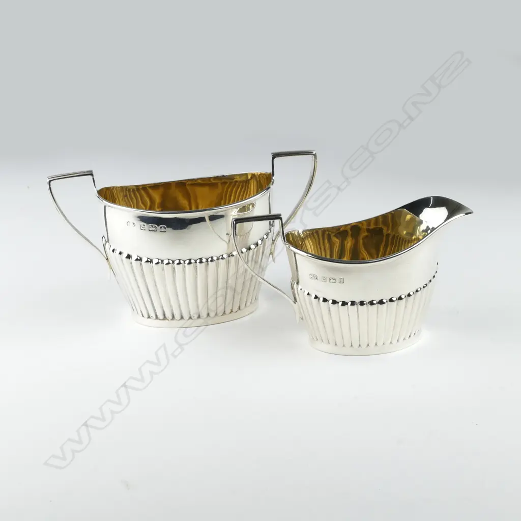 An early 1900 silver cream and sugar Image 1++