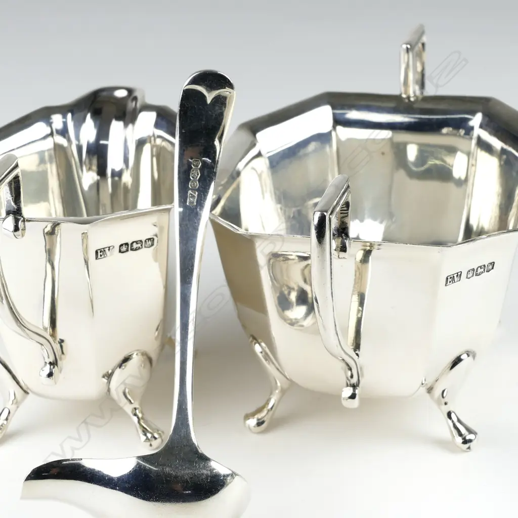 A silver milk jug Image 1++