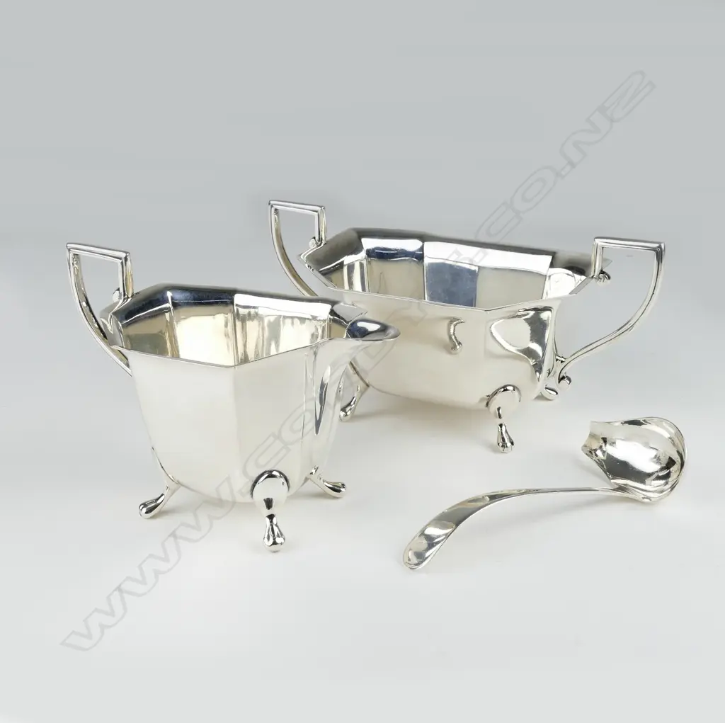 A silver milk jug Image 1++