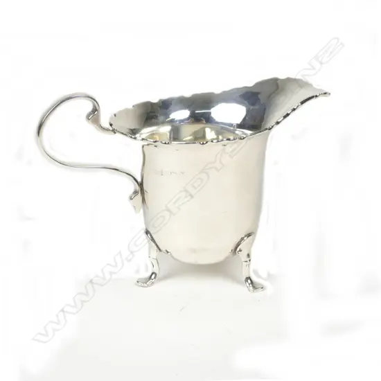 A small silver cream jug