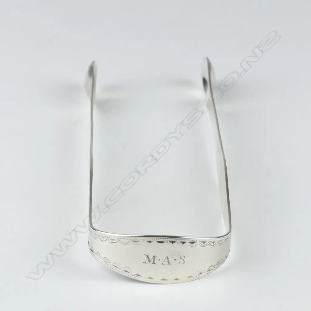 A pair of silver George III sugar tongs Image 1++